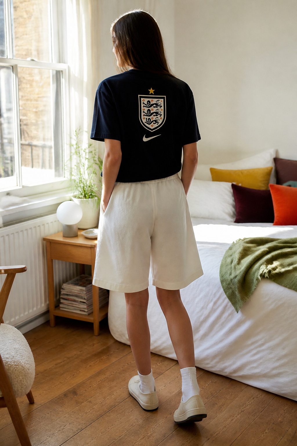 A Nike Straight Fit Graphic T-Shirt with a club crest and casual outfit.