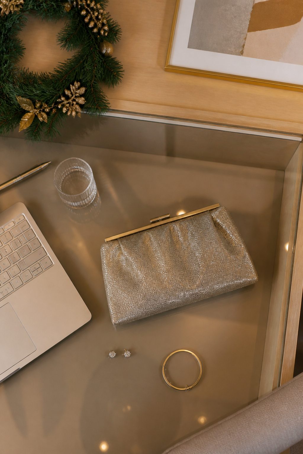 A metallic clutch and delicate jewelry for holiday party accessories.